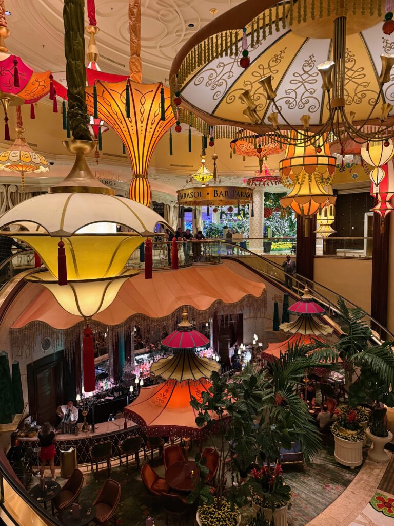 Bar Parasol at the Wynn hotel. View from the top looking down at the bar which has parasols hanging at different heights above it.